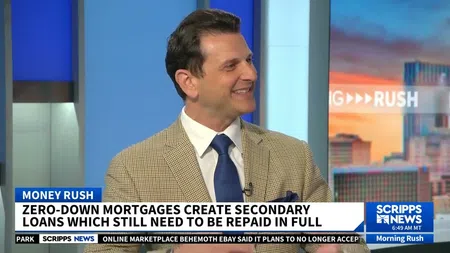Man in beige checkered blazer and blue tie smiling on Scripps News Morning Rush segment about zero-down mortgages.