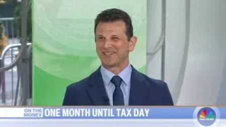 Man in blue suit and tie smiling during a TV segment with text about one month until tax day