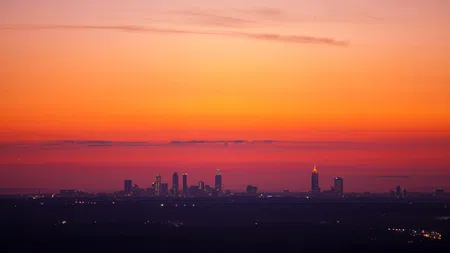 a city skyline at sunset