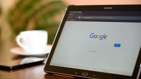 a tablet with a cup of coffee