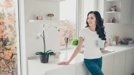 a woman standing in a kitchen