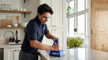 a man cleaning a counter