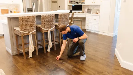 a person kneeling on the floor