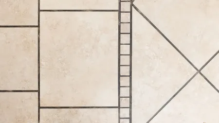 dirty grout lines on a beige tile floor