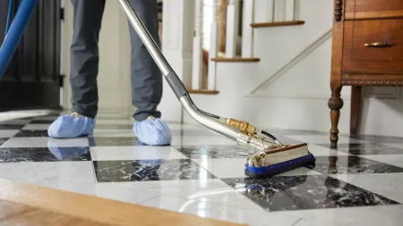 a person vacuuming a room