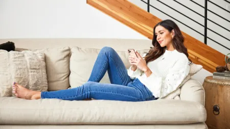 a woman sitting on a couch