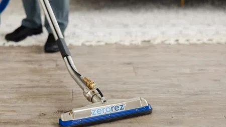 Professional cleaning of hardwood floor using Zerorez equipment for a spotless finish.