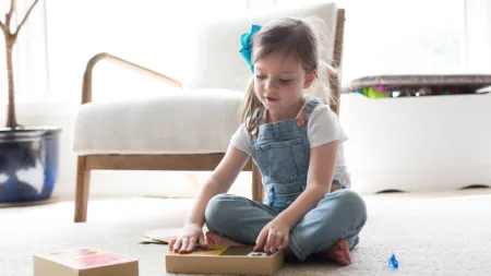 a child sitting on the floor