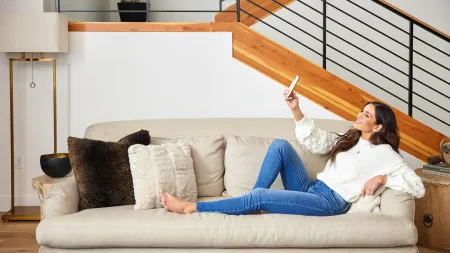 a woman sitting on a couch