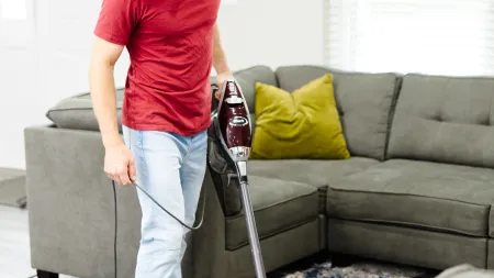 a man with a vacuum