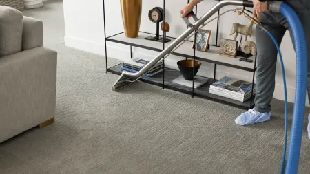 a person standing next to a shelf with objects on it