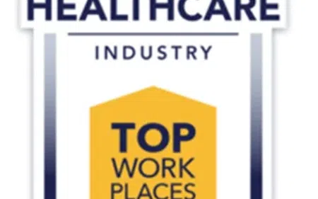 Healthcare Industry Top Workplaces 2025 badge with a yellow ribbon and blue border design.