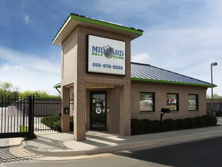 a brick building with a sign on it