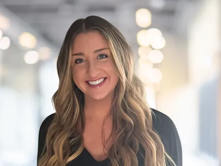 a woman with long hair smiling