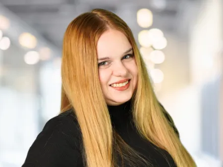 a woman with long hair smiling