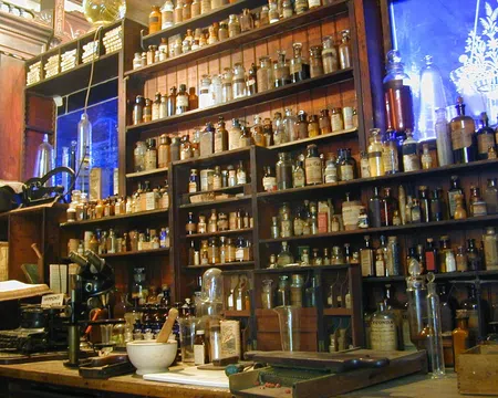 Shelves filled with vintage apothecary jars and bottles in an old-style pharmacy setting.
