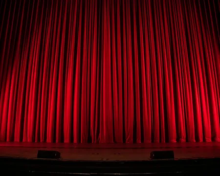 a stage with a curtain