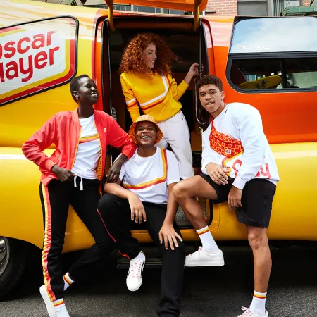 a group of people posing for a photo in front of a fire truck