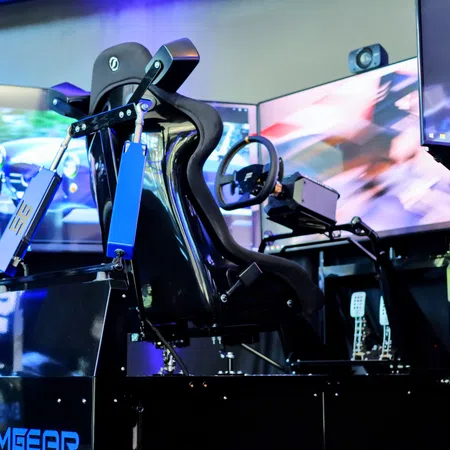 Sleek racing simulator setup with high-tech monitors, steering wheel, and driver seat for immersive experience.