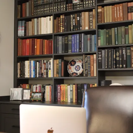 a black computer tower with a white laptop on top