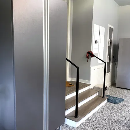 a hallway with a metal railing