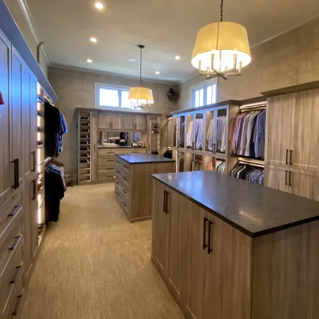 a kitchen with a bar and cabinets