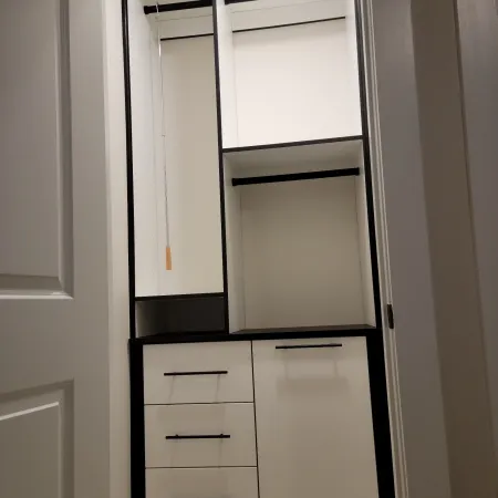 a white cabinet with drawers