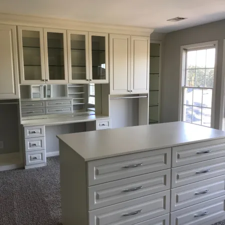 a kitchen with white cabinets