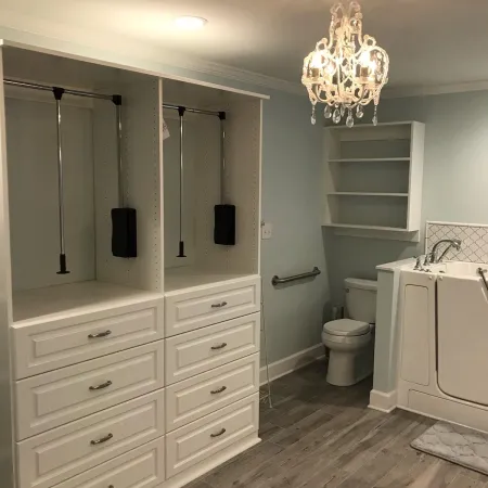 a bathroom with a chandelier and a toilet