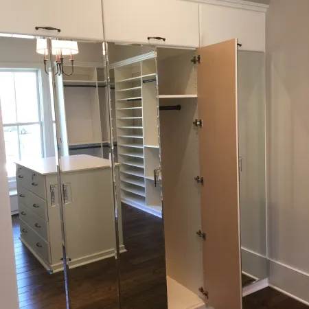 a room with a glass door and a metal cabinet