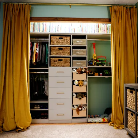 a closet with a shelf and shelves