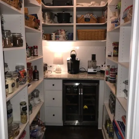 a kitchen with white cabinets