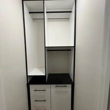 a closet with a shelf