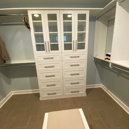 a white cabinet with drawers