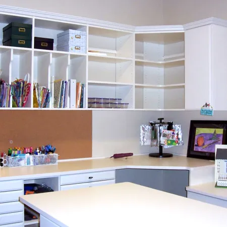 a room with a desk and shelves with objects on it