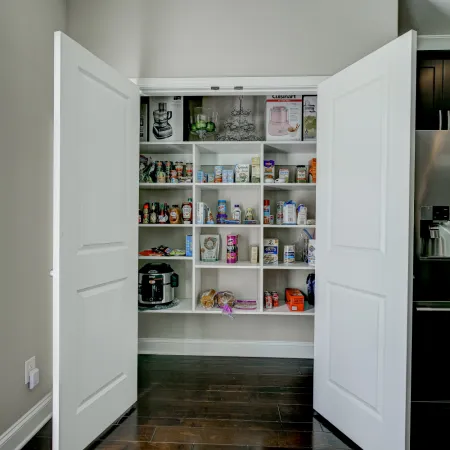 a kitchen with white cabinets