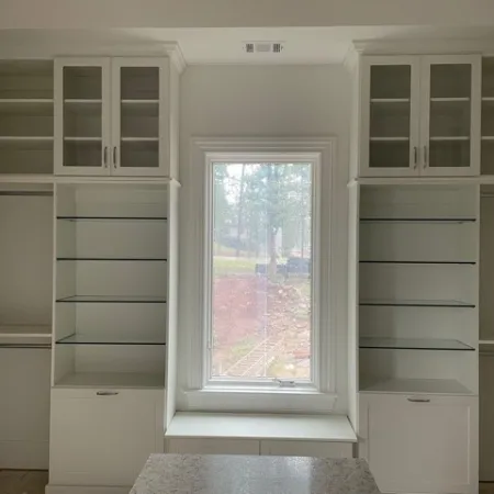 a white cabinet with white drawers