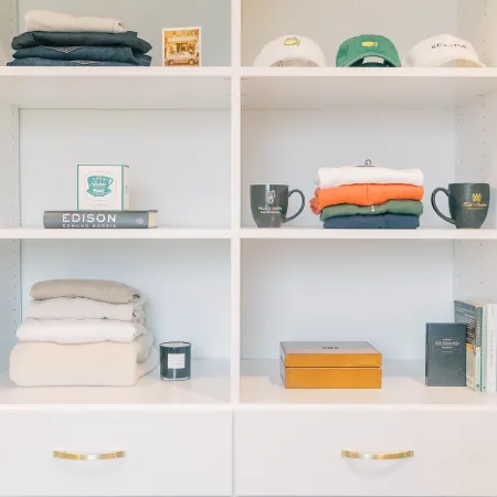 a white shelving unit with various items on it