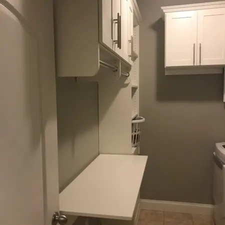 a kitchen with white cabinets