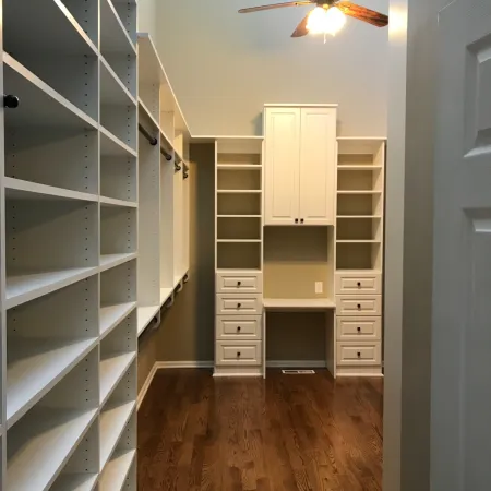 a room with shelves and a ceiling fan