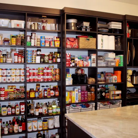 a shelf with bottles of alcohol