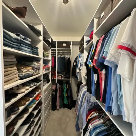 a room with shelves of clothes