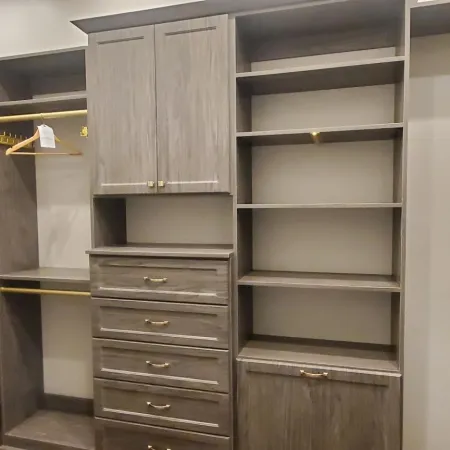 a room with shelves and drawers