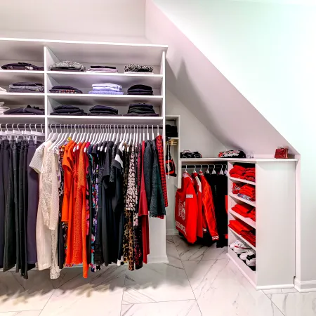 a closet with clothes and clothes