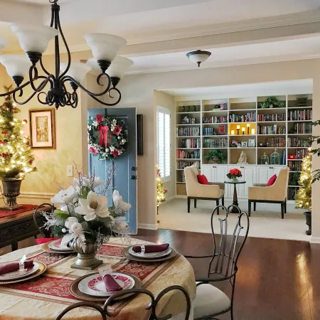 a dining room with a table and chairs