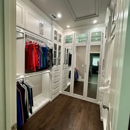 a closet with clothes