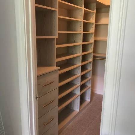 a room with shelves and a door