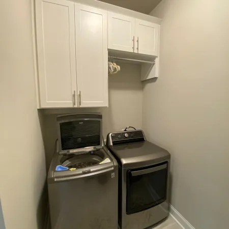 a kitchen with white cabinets