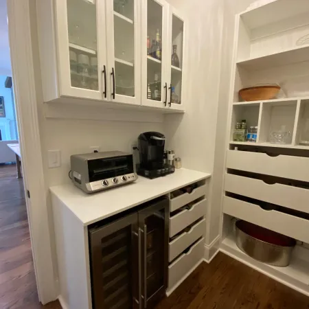 a kitchen with white cabinets