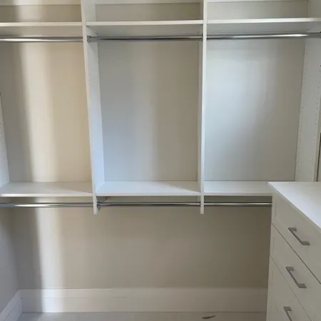 a white cabinet with a white door